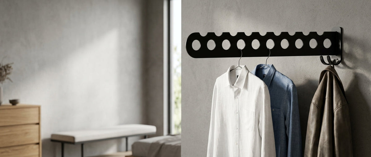Hanger rack holding white shirt, denim shirt and leather jacket